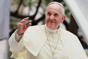 Pope Francis waving to a crowd in 2013.